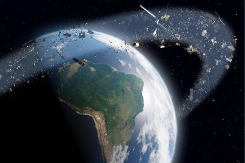 Simulation von zahlreichen Satellitentrümmern, die in einer Umlaufbahn die Erde umgeben.